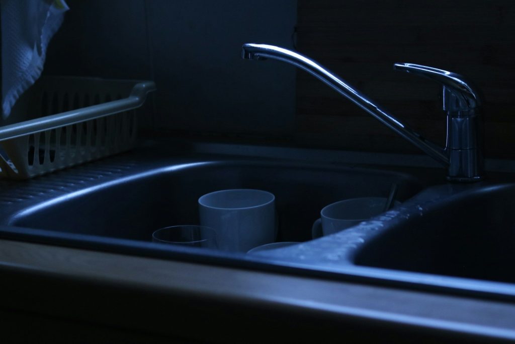 "Standing water in a dishwasher tub. Mean 28 — dark, and the name already says exactly this page" — water standing in the bottom when the cycle ends, which is this page's caption